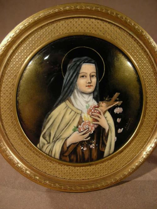 Charming and rare enamelled St Therese of Lisieux.